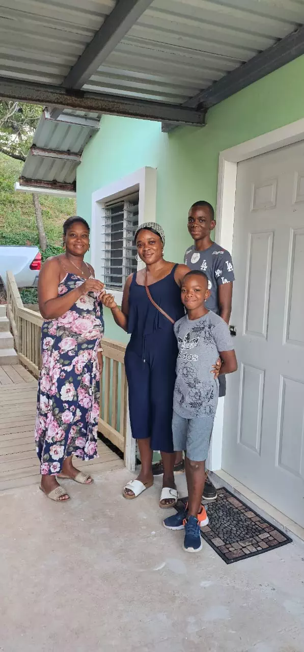 Family at Los Suenos in Roatan in front of the door